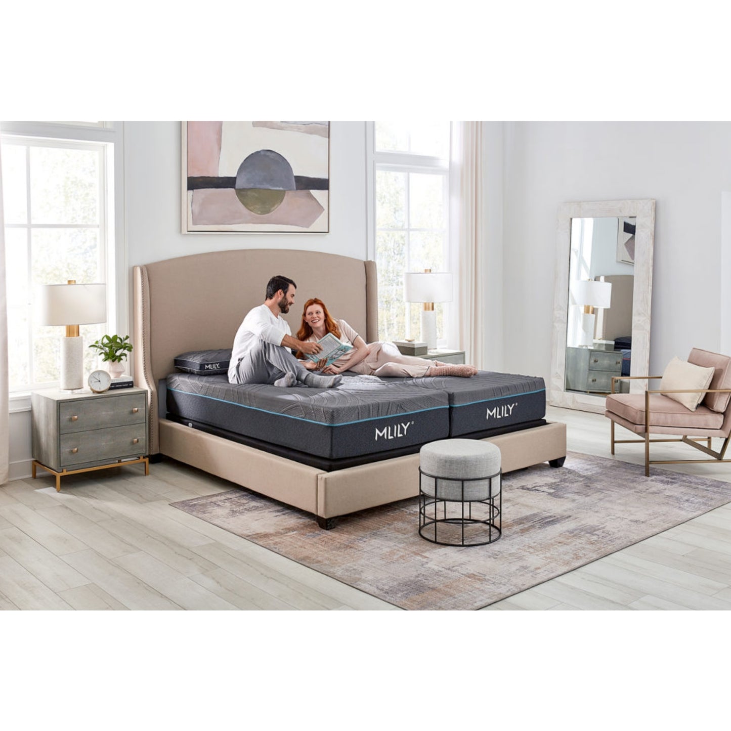 Firm PowerCool 11.5" Hybrid Mattress With Ventilated Memory Foam Pillow(s) And Adjustable Base Featuring Integrated Cooling Fans Inside Of A Bedroom With Man And Woman Enjoying Each Other's Company, Corner View