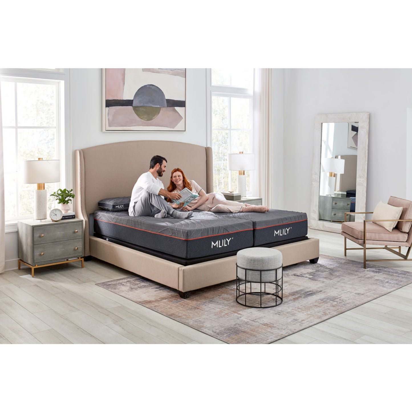 Medium PowerCool 11.5" Hybrid Mattress With Ventilated Memory Foam Pillow(s) And Adjustable Base Featuring Integrated Cooling Fans Inside Of A Bedroom With Man And Woman Enjoying Each Other's Company, Corner View