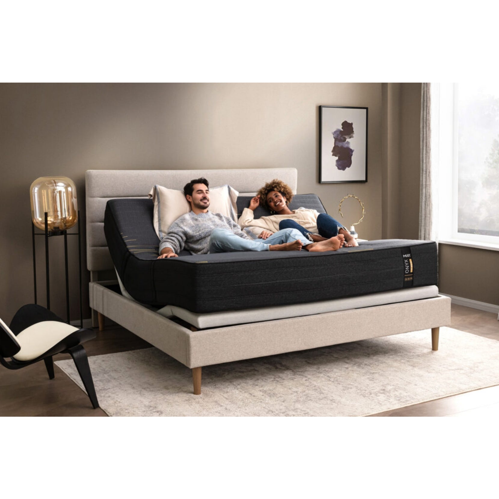 ONYX 12" Hybrid Mattress With Copper Infused Memory Foam Inside Of A Bedroom With A Man And Woman Enjoying Each Other's Company While Having Their Head And Foot Slightly Elevated