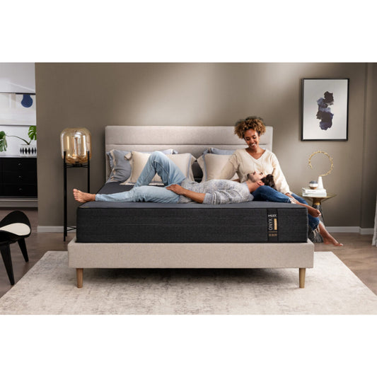 ONYX 12" Hybrid Mattress With Copper Infused Memory Foam Inside Of A Bedroom With A Man And Woman Enjoying Each Other's Company