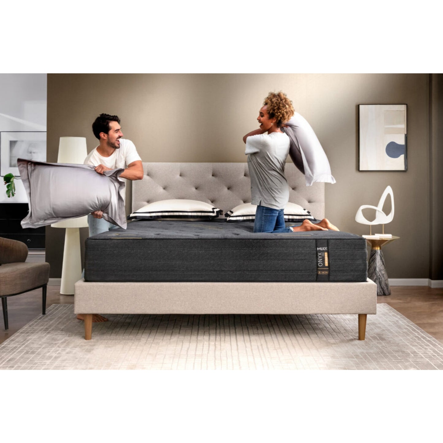 ONYX Pro 13" Hybrid Mattress With Copper Infused Memory Foam Inside Of A Bedroom With A Man And Woman Pillow Fighting
